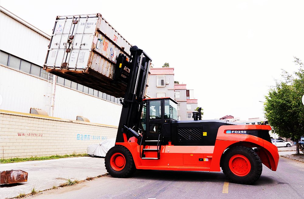 Heavy-duty diesel forklift lifting a shipping container at an angle in an industrial yard Heavy-duty diesel forklift lifting a shipping container at an angle in an industrial yard